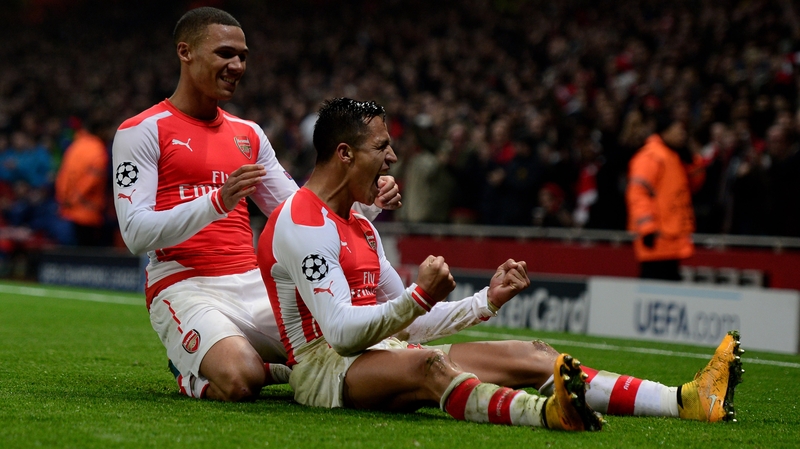 Alexis Sanchez of Arsenal celebrates with team-mate Kieran Gibbs (l) after scoring his team's second goal
