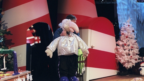 Pat Kenny holds a giant Dustin toy in 1999