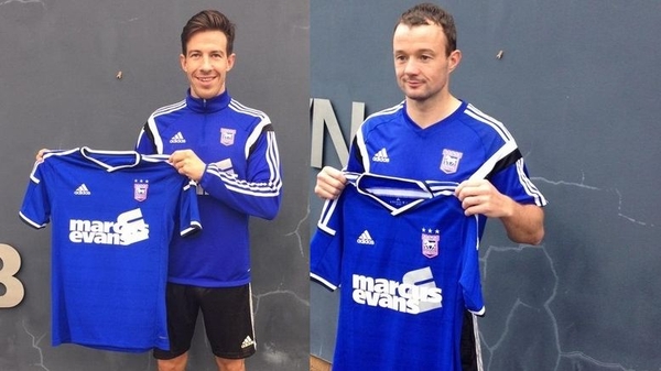 Ipswich Town signings Sean St Ledger (L) and Noel Hunt pose with their jerseys. Pic:@Official_ITFC