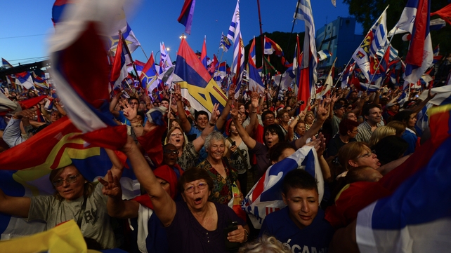 Frente Amplio political supporters cheer during the closing rally of the campaign in Montevideo, Uruguay