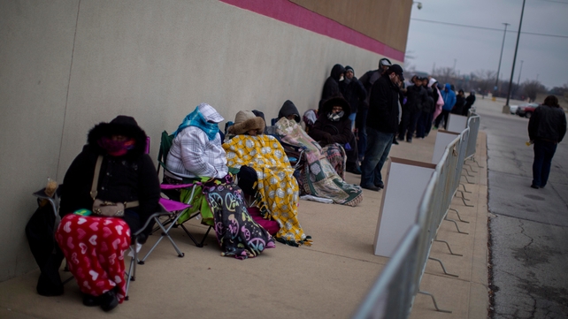 Shoppers wait in line for early 'Black Friday' deals Thanksgiving evening in Indianapolis, Indiana
