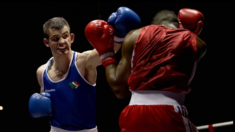 Adam Nolan (blue) in action against Daouda Sangare