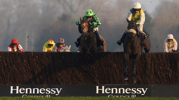 Leighton Aspell riding Many Clouds (R) clear at the last to win The Hennessy Gold Cup from Houblon Des Obeaux