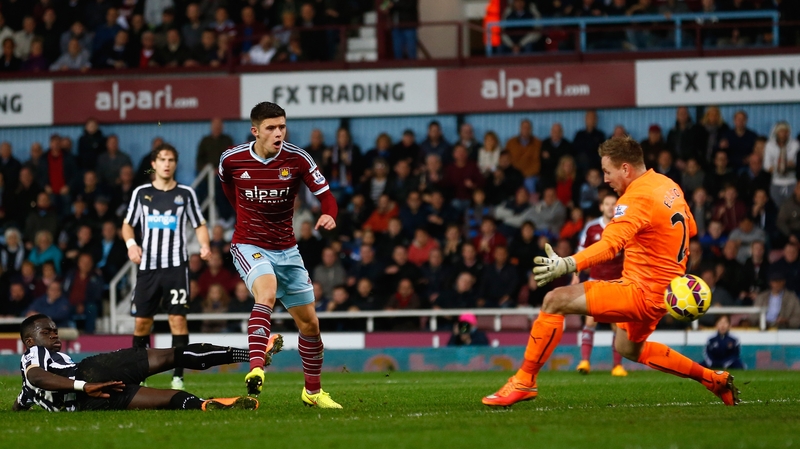 Aaron Cresswell of West Ham scores the opening goal past Robert Elliot