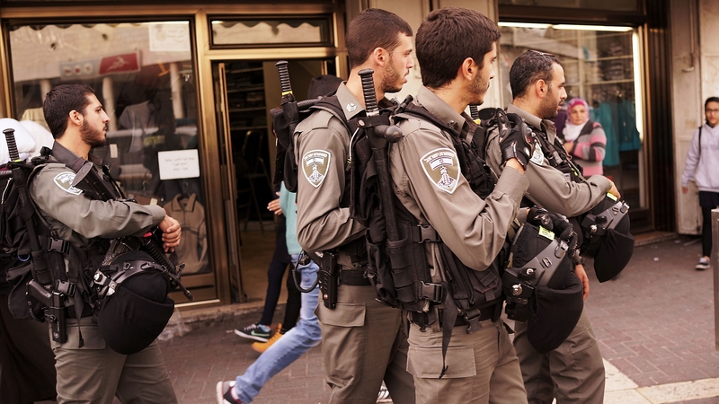 Soldiers walk the streets of Jerusalem
