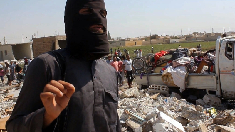 File image of an IS fighter in Syrian city of Raqa