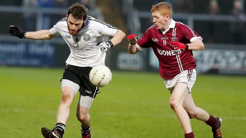 Christopher Bradley (right) hit the match-winning point for Slaughtneil