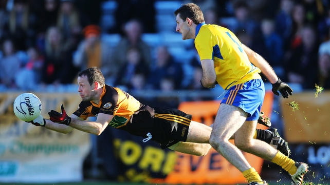 Austin Stacks' Mikey Collins under pressure from Diarmuid Wall of The Nire