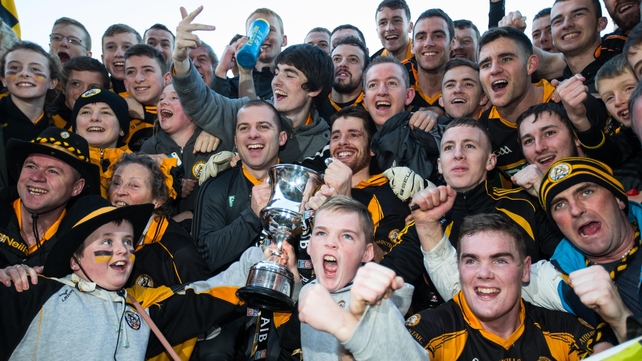 Austin Stacks players and supporters celebrate with the cup after winning the Munster Club SFC