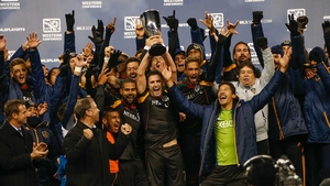Robbie Keane gets his hands on the Western Conference trophy following an away-goals win against Seattle Sounders