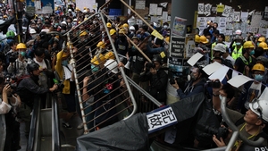 Protesters and police clash outside the government headquarters in Hong Kong