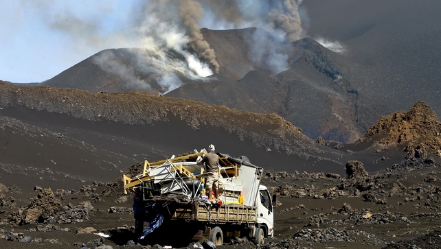 Inhabitants collect belongings at Portela, Fogo Island, Cape Verde. Volcanologic Observatory information the volcano became more active with 'intense explosions' with greater lava flow