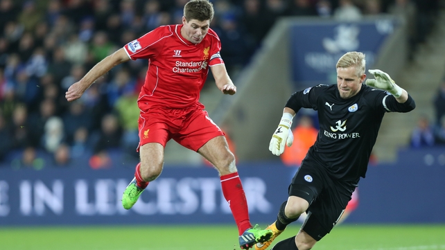 Liverpool's Steven Gerrard (L) under pressure from Leicester City's Kasper Schmeichel during their Premier League clash