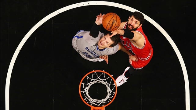 Mirza Teletovic of the Brooklyn Nets and Nikola Mirotic of the Chicago Bulls jump for a rebound at the Barclays Center in New York City