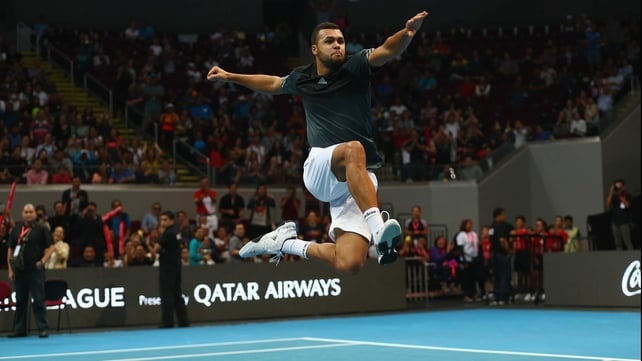 Jo-Wilfried Tsonga celebrates after victory in his doubles match at the Coca-Cola International Premier Tennis League at the Mall of Asia Arena