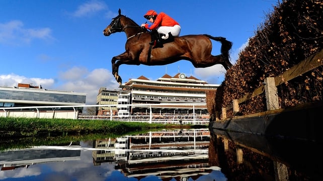 Stevn Clements riding Susquehanna River clear the water jump in The Burges Salmon Amateur Riders' Handicap Steeple Chase at Newbury