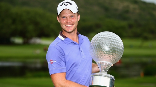 Danny Willett poses with the Nedbank Golf Challenge trophy
