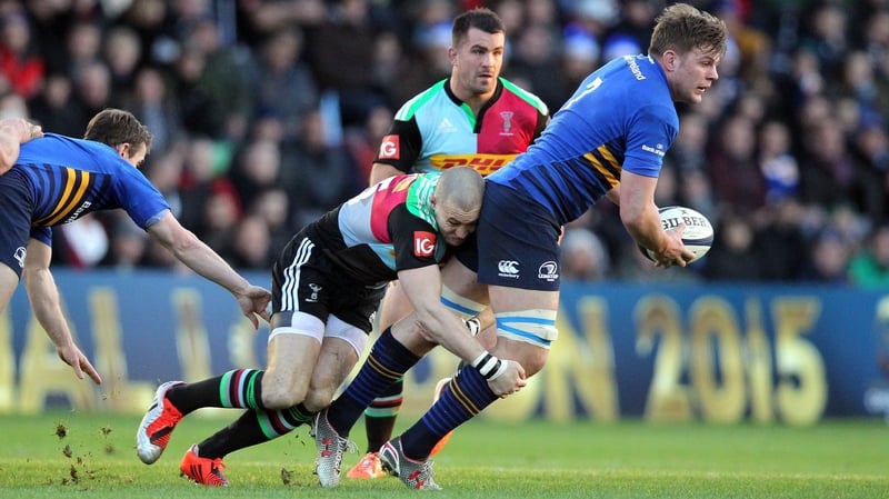 Leinster's Jordi Murphy is caught by Harlequins' Mike Brown