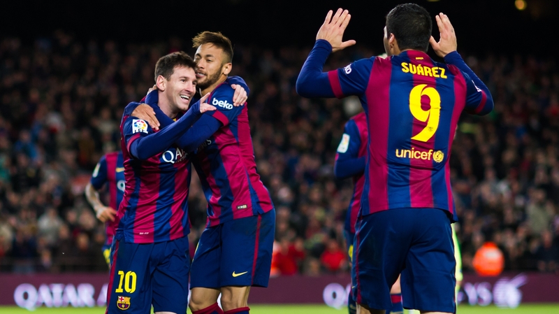 Hat-trick man Lionel Messi is hugged by Neymar as Luis Suarez comes to celebrate too