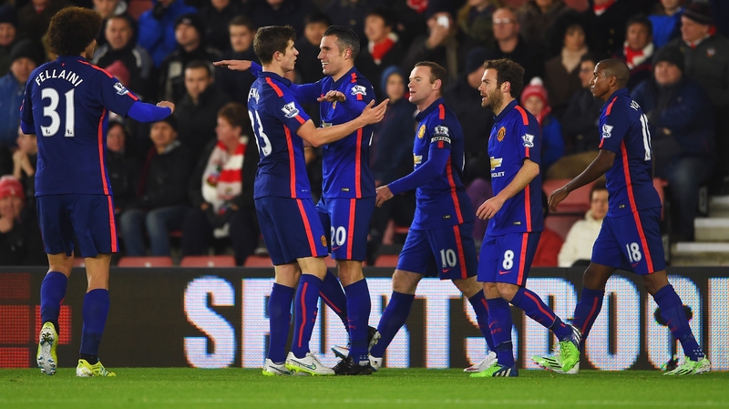 Robin van Persie is congratulated after scoring the first of his two goals against Southampton