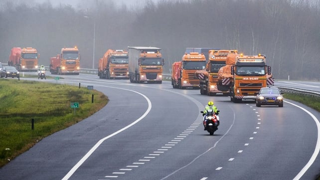 Trucks carrying the wreckage of MH17 on the A1 highway near De Lutte in the Netherlands