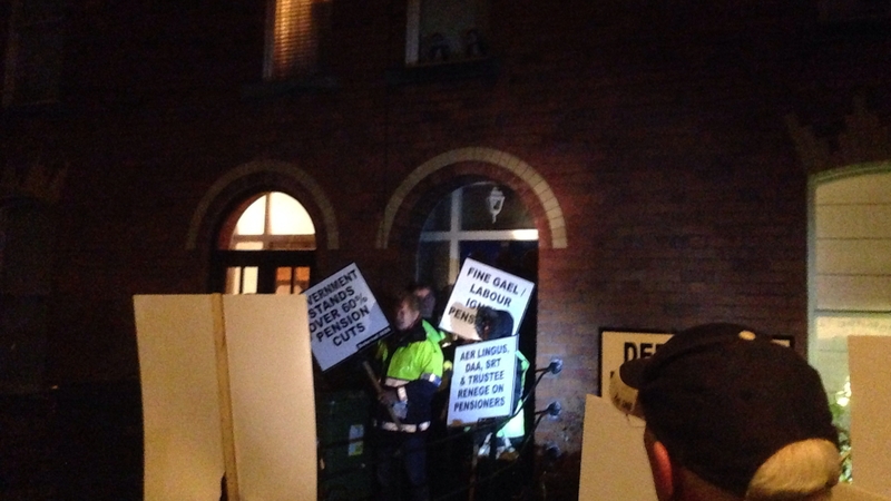 The crowd carried placards and shouted slogans for about an hour in the street outside Mr Donohoe's house in Phibsboro