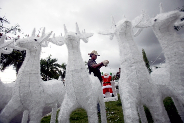 A worker prepares Christmas decorations at the Prime Minister's office in Dili, East Timor