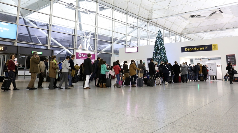 People queueing at Stansted Airport in London after flights were delayed