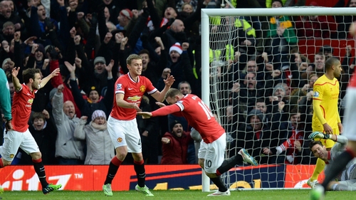 Wayne Rooney celebrates the game's opening goal