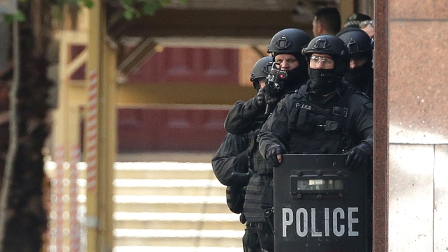 Armed police outside the café