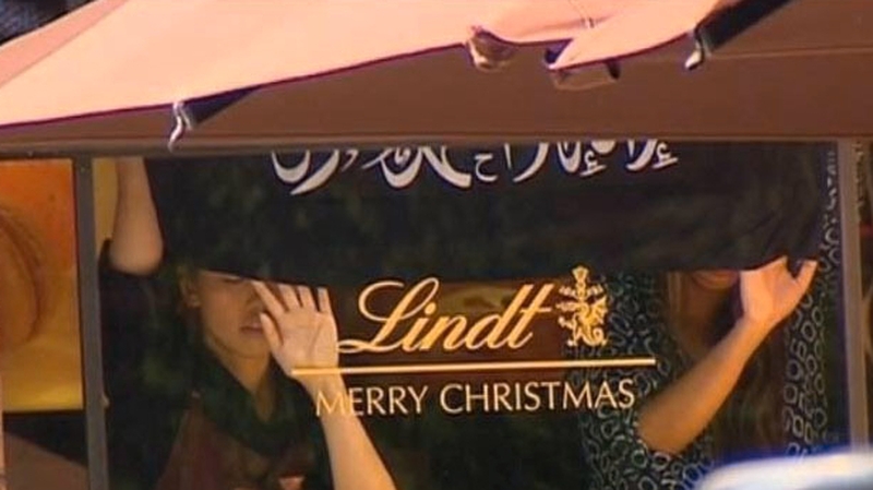Officials will not say how many people are still being held in the Lindt Chocolat Caf