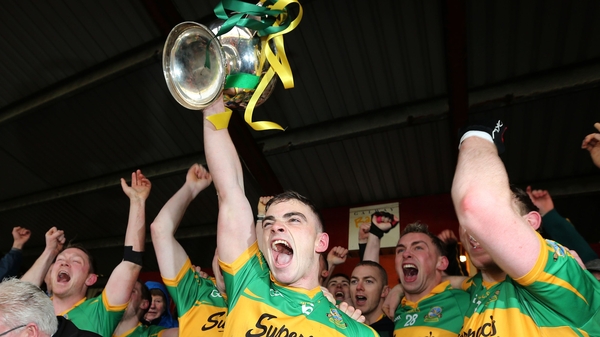 Greg Lally lifts the Tom Callanan cup
