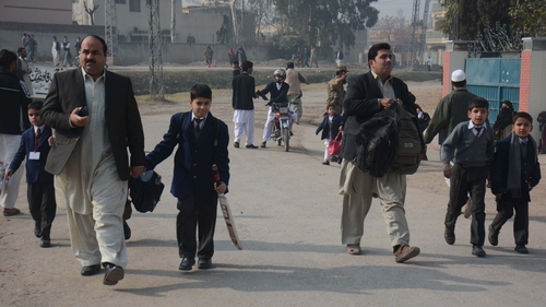 Parents collect children who survived the attack