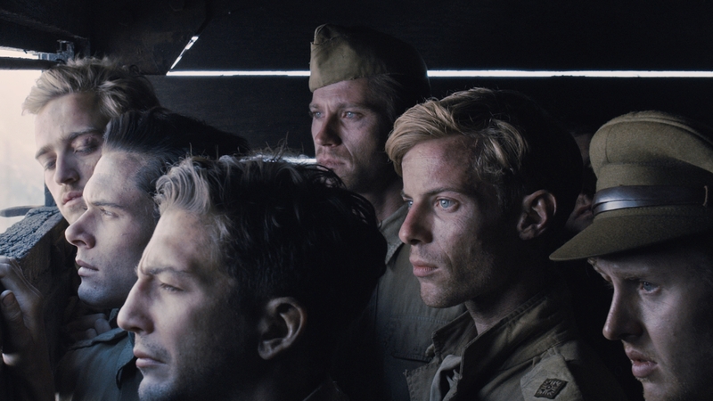 Anderson (wearing peaked cap) and Treadaway (to his immediate right) in Unbroken