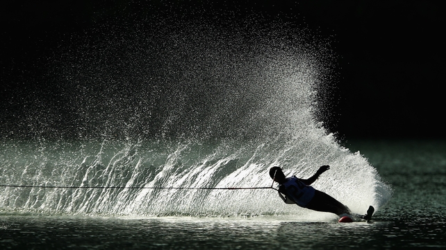 A competitor does a manoeuvre during the Open Ladie's Waterski Slalom at the Asian Beach Games