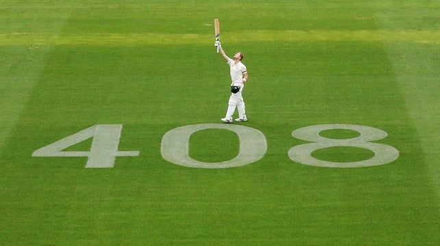 Australia's Steve Smith celebrates his century beside the no. 408 displayed as a tribute to the late Phillip Hughes who was the 408th test player for Australia