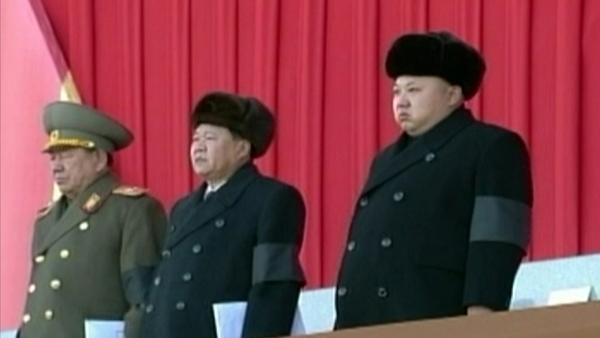 Kim Jong-un (R) attends an event in Pyongyang, to mark the third anniversary of the death of his father