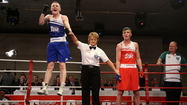 Dean Walsh jumps for joy as he is declared the winner over Michael Nevin at the Elite Championships