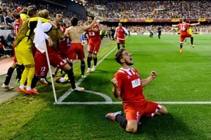 Daniel Carrico of Sevilla FC celebrates after Stephane Mbia scored his team's first goal in the Europa League Semi Final
