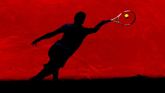Grigor Dimitrov of Bulgaria plays a forehand from the shadows at the Mutua Madrid Open tennis
