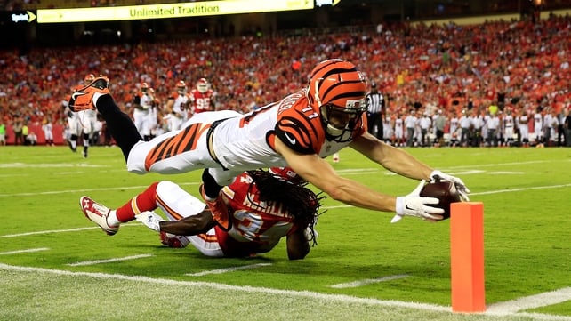 Dane Sanzenbacher of the Cincinnati Bengals dives to score a touchdown as Jerron McMillian of the Kansas City Chiefs defends