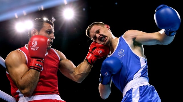 Canada’s Samir El-Mais lands a punch on David Light of New Zealand at the Glasgow Commonwealth Games