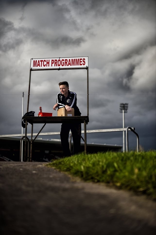 Cain Bradley helps out selling programmes ahead of the Ulster SFC quarter-final game between Omagh and Crossmaglen