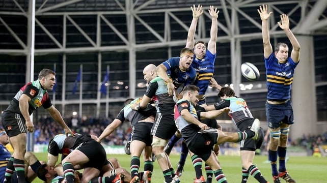 Leinster's Dominic Ryan, Jack Conan and Devin Toner try to block Danny Care of Harlequins clearance at the Aviva Stadium
