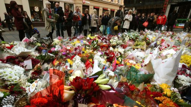 Floral tributes left in Glasgow, as police remove the cordons at the scene of yesterday's bin lorry crash