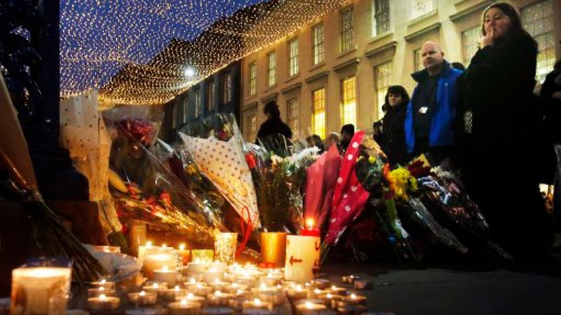 Numerous floral tributes have been laid outside the Gallery of Modern Art