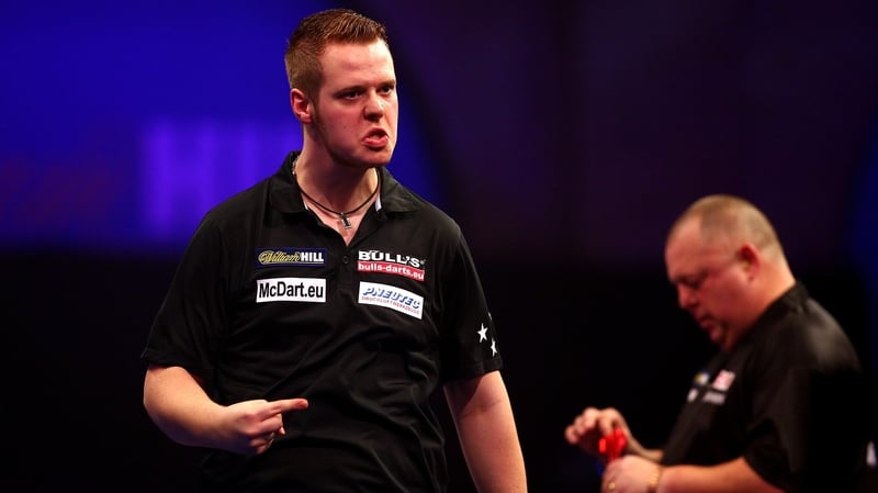 Max Hopp of Germany celebrates winning his first round match against Mervyn King