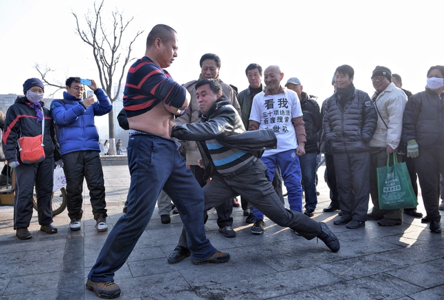 'Iron Belly' man Guo Haijun invites onlookers to punch him in the stomach in Shenyang, China