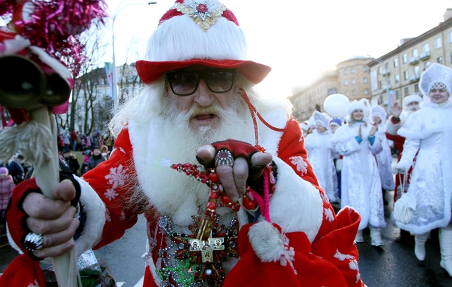 A man dressed as Father Frost, the equivalent of Santa Claus, takes part in an annual New Year's parade in Minsk