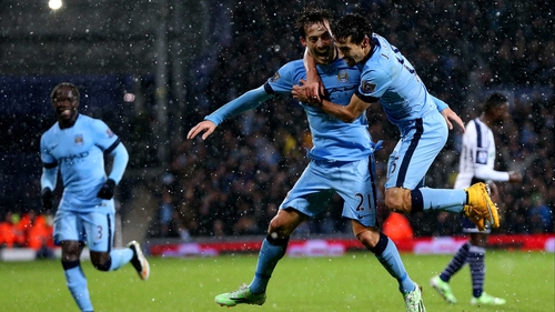 Jesus Navas celebrates with David Silva as City romped past West Brom